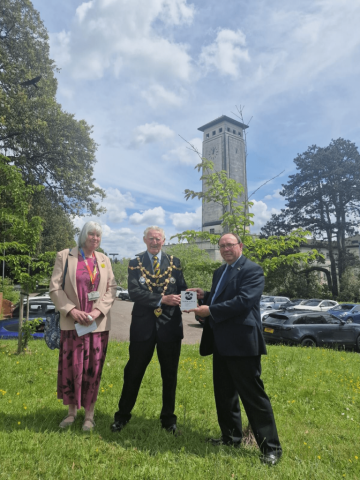 The Mayor of Newport, Councillor Trevor Watkins is being presented with a Sakura Cherry Tree plaque by Keith Dunn OBE, Honorary Consul for Japan in Wales. Councillor Yvonne Forsey, Cabinet Member for Climate Change was also in attendance Sakura Cherry Tree plaque, to mark over 200 Cherry Trees that have been planted in the City of Newport